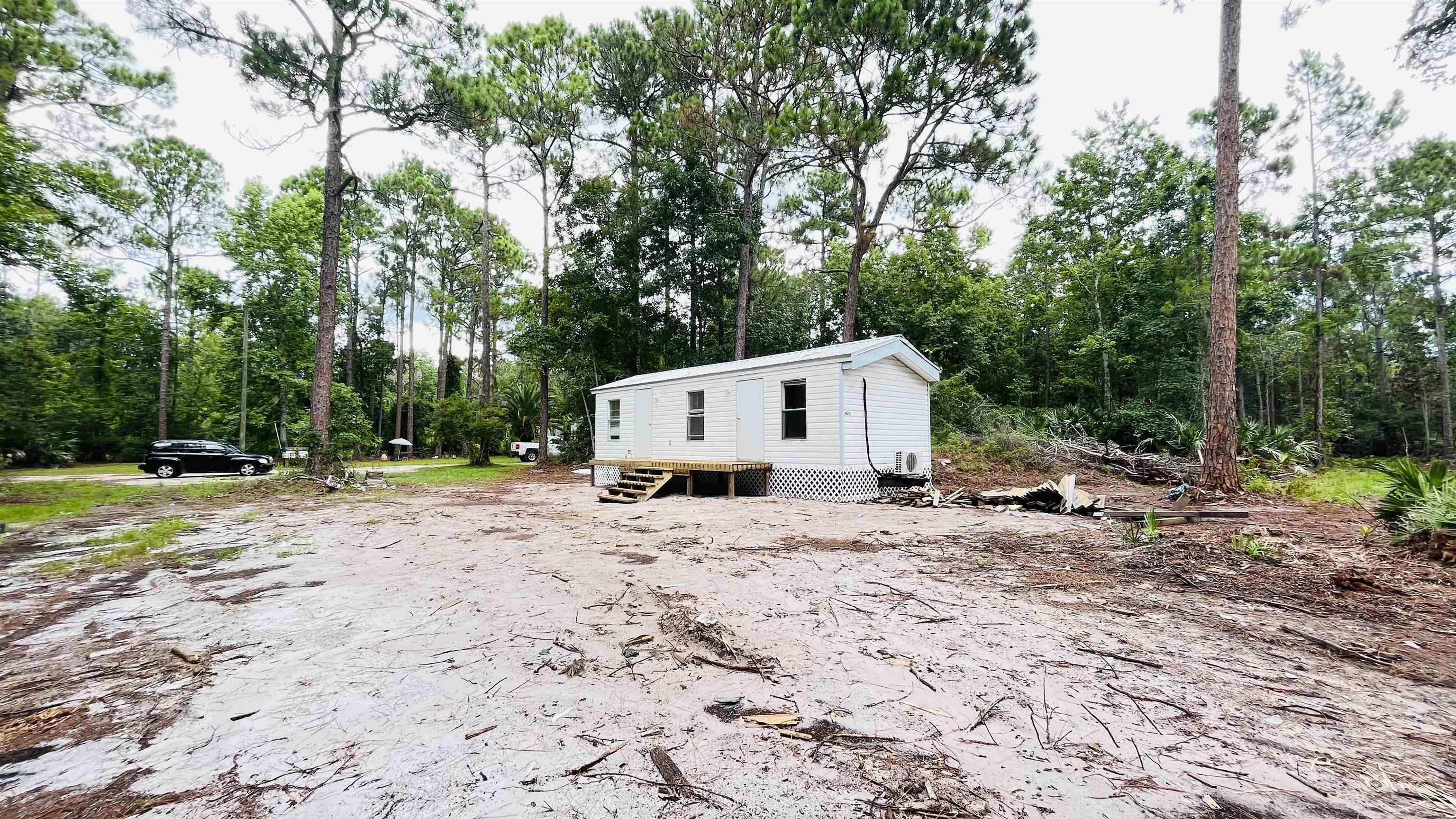 2100 Deer Run Road St. Augustine, FL 32084 - Photo 11 of 17 a view of a house with backyard space and a tree