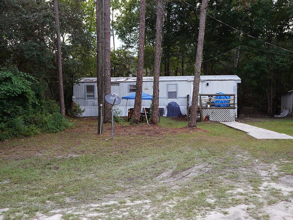 2100 Deer Run Road St. Augustine, FL 32084 - Photo 13 of 17 a view of a chairs in a backyard