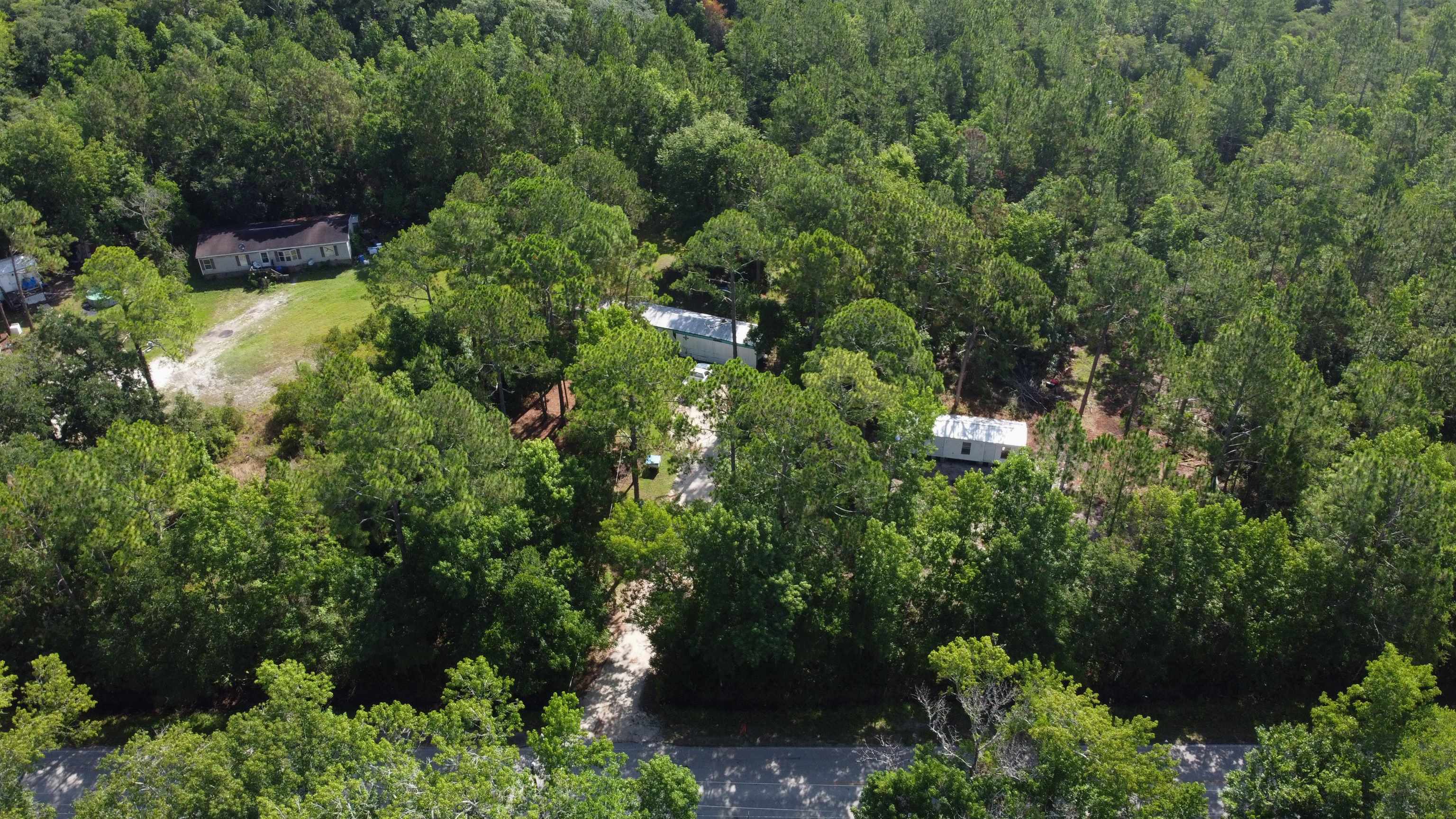 2100 Deer Run Road St. Augustine, FL 32084 - Photo 7 of 17 an aerial view of residential house with outdoor space and trees all around
