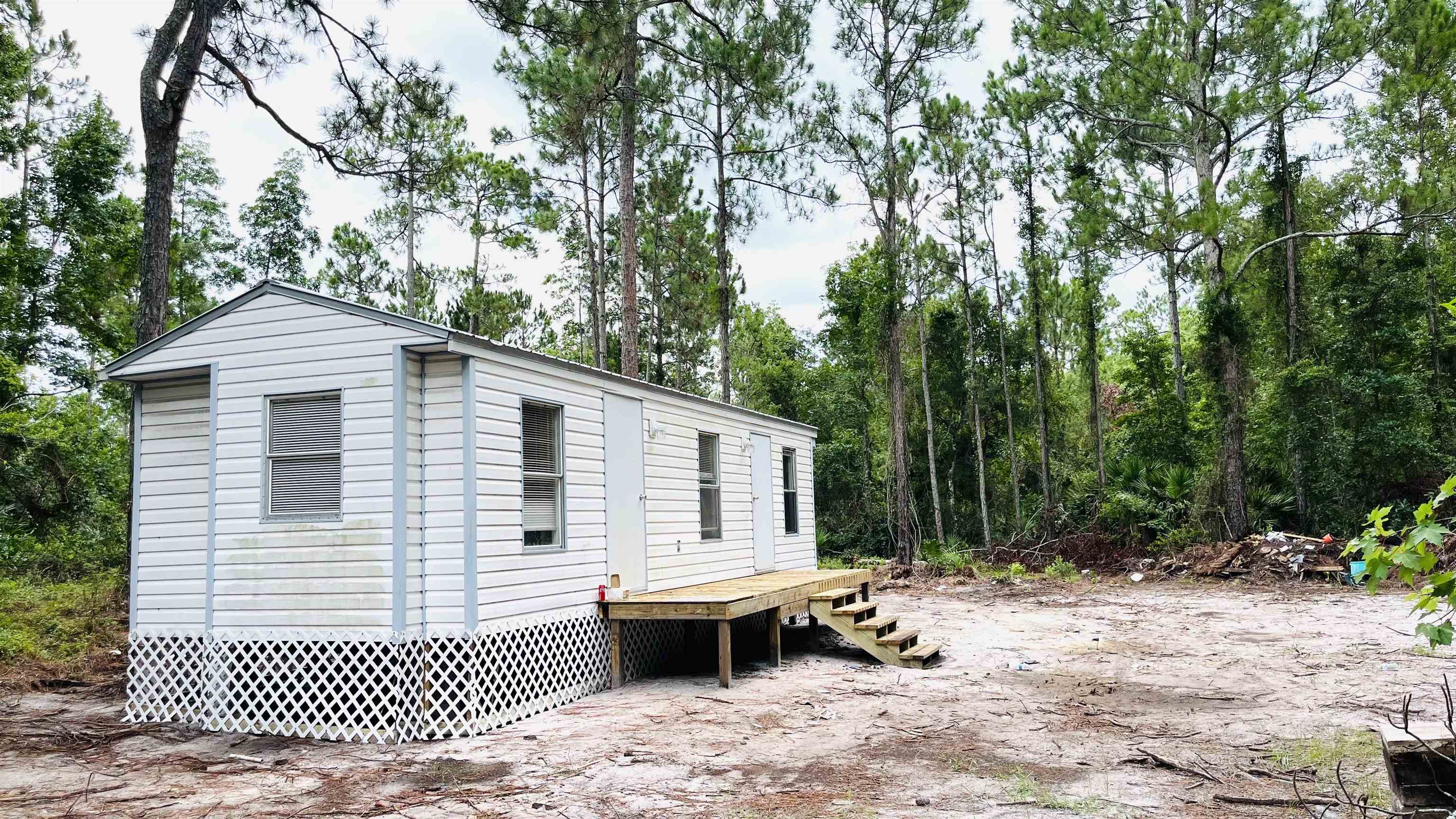 2100 Deer Run Road St. Augustine, FL 32084 - Photo 10 of 17 a view of a patio with a table and chairs