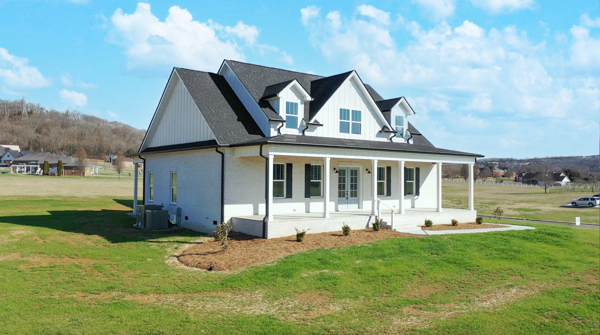 222 Red Hill Road Normandy, TN 37360 - Photo 3 of 51 a front view of a house with a yard table and chairs