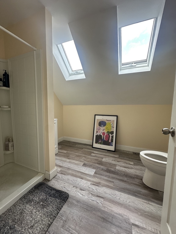 22 Winslow Road Brookline, MA 02446 - Photo 13 of 25 a view of a hallway with wooden floor and a window