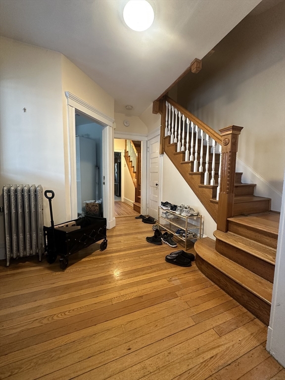 22 Winslow Road Brookline, MA 02446 - Photo 2 of 25 a view of entryway with wooden floor and stairs