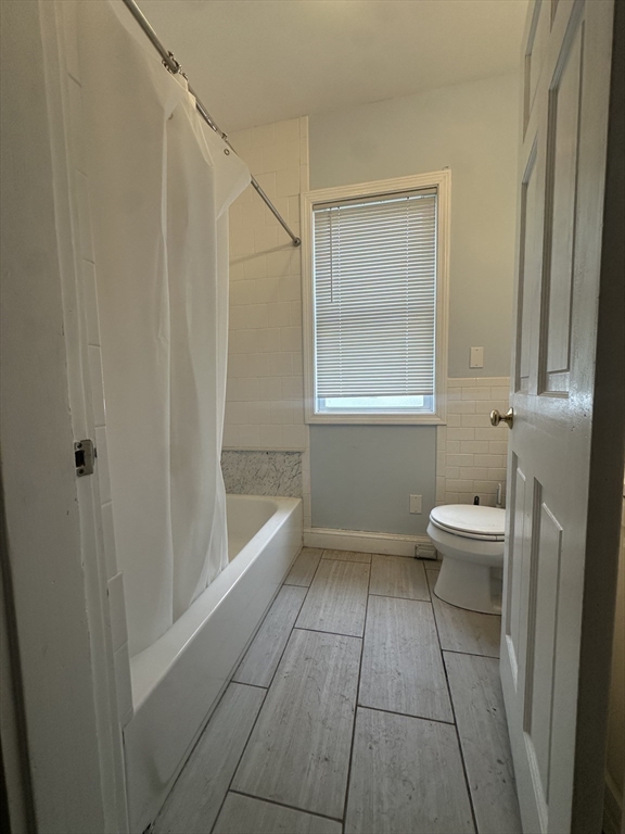 22 Winslow Road Brookline, MA 02446 - Photo 21 of 25 a bathroom with a sink a toilet and shower