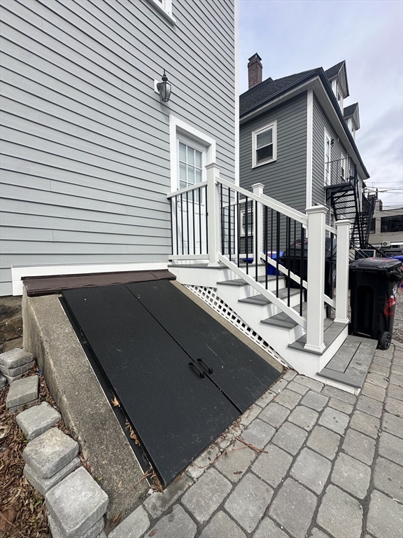 22 Winslow Road Brookline, MA 02446 - Photo 24 of 25 a view of a terrace with chairs