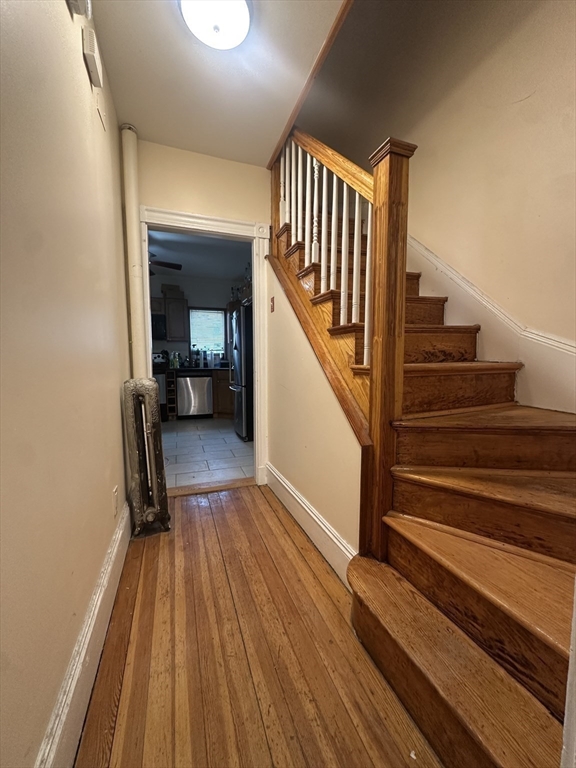 22 Winslow Road Brookline, MA 02446 - Photo 5 of 25 a view of entryway and hall with wooden floor