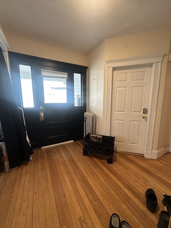 22 Winslow Road Brookline, MA 02446 - Photo 8 of 25 a view of a livingroom with furniture and wooden floor