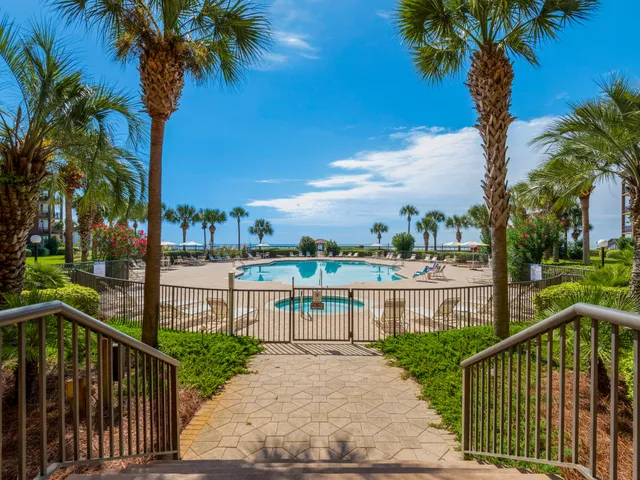 a view of a street with a iron fence