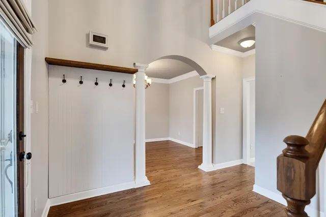 a view of hallway with wooden floor
