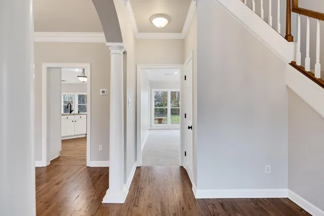 wooden floor in a hall with a window