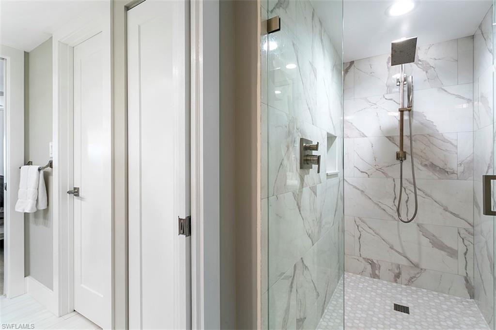 6573 Marissa Loop, Unit 903 Naples, FL 34108 - Photo 13 of 25 a bathroom with a shower