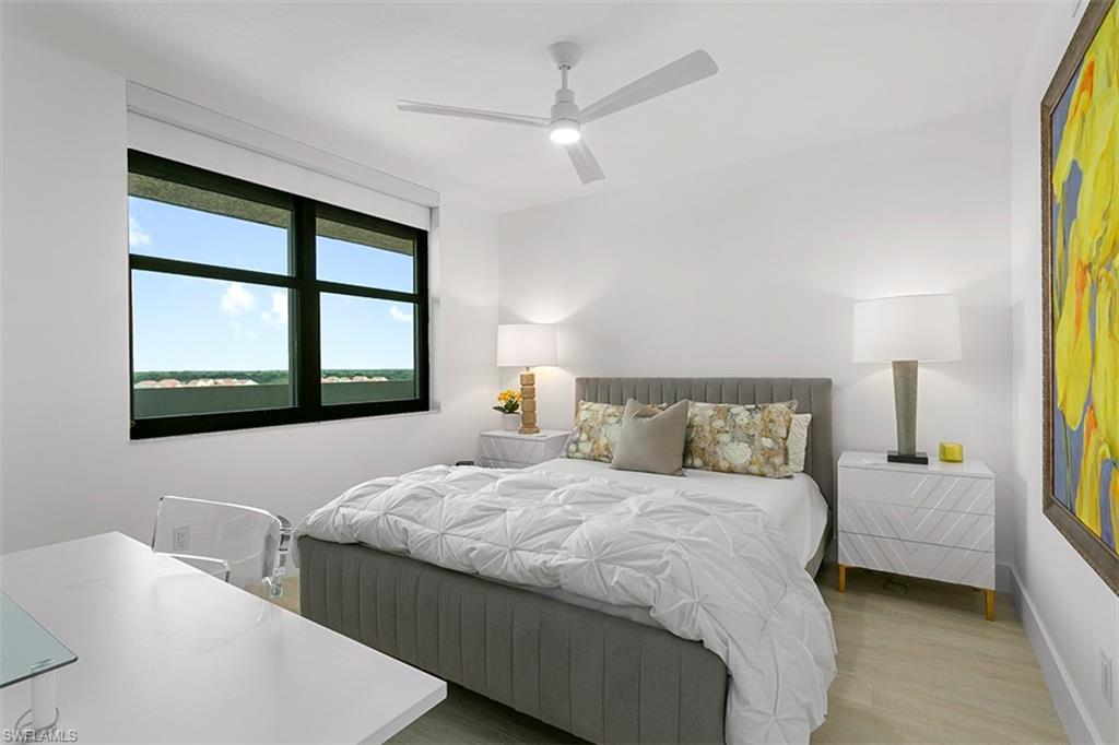 6573 Marissa Loop, Unit 903 Naples, FL 34108 - Photo 14 of 25 a bedroom with a bed and a window
