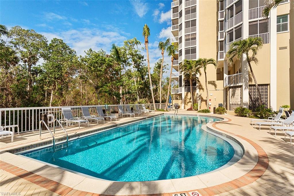 6573 Marissa Loop, Unit 903 Naples, FL 34108 - Photo 18 of 25 a view of a swimming pool with a patio