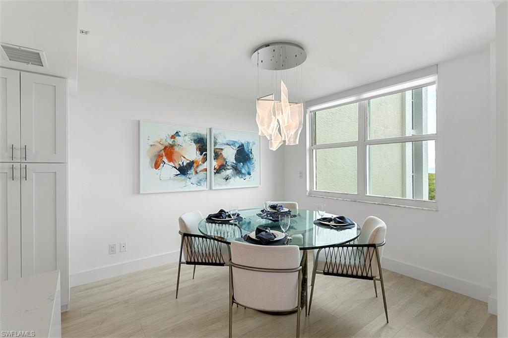 6573 Marissa Loop, Unit 903 Naples, FL 34108 - Photo 7 of 25 a dining room with furniture and window