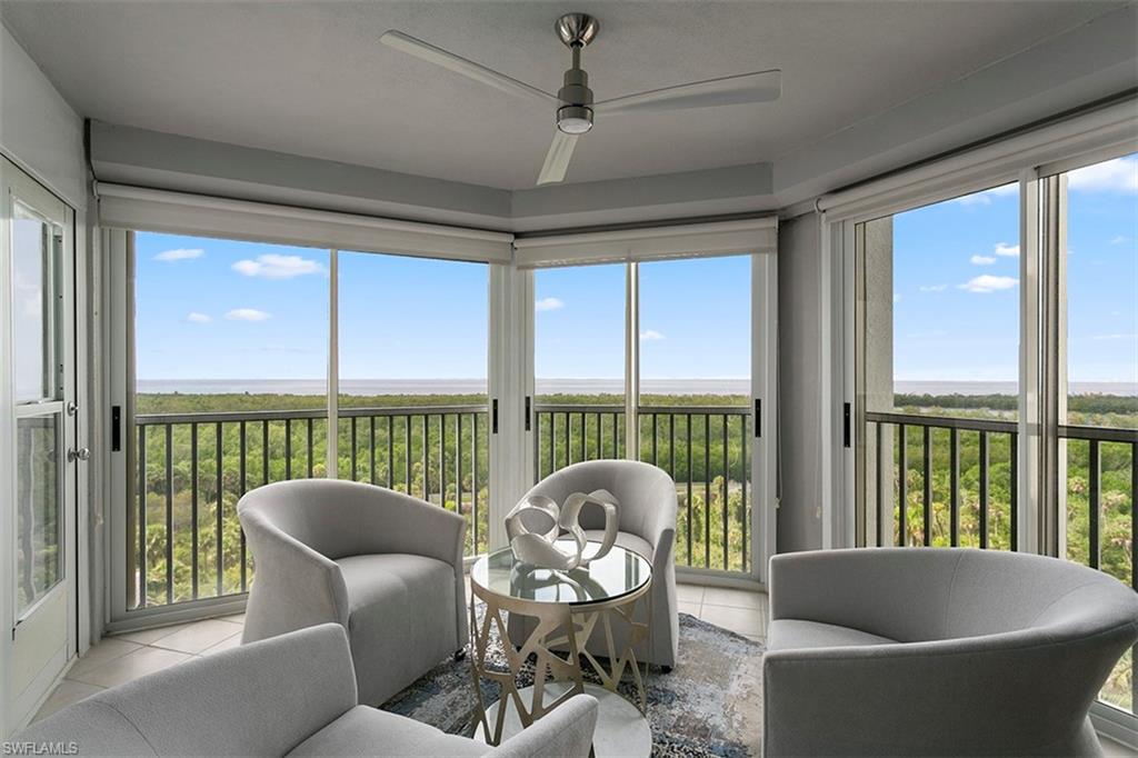 6573 Marissa Loop, Unit 903 Naples, FL 34108 - Photo 9 of 25 a living room with furniture and a window