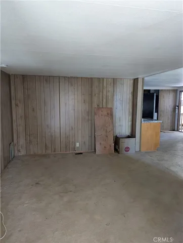 en empty room with windows and closet