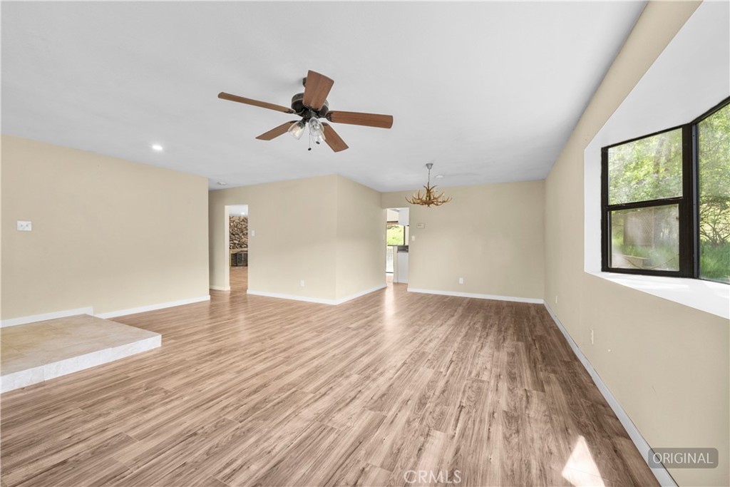 29570 Butterfield Way Tehachapi, CA 93561 - Photo 15 of 50 a view of empty room with wooden floor and fan