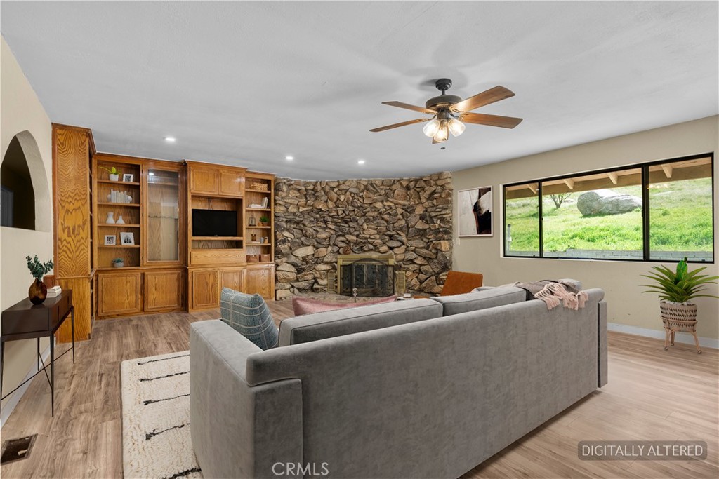 29570 Butterfield Way Tehachapi, CA 93561 - Photo 20 of 50 a living room with fireplace furniture and a large window