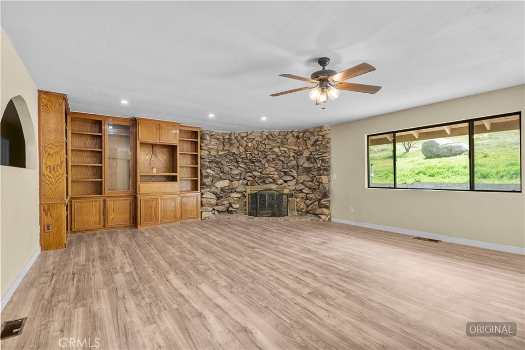 29570 Butterfield Way Tehachapi, CA 93561 - Photo 21 of 50 a view of a kitchen with microwave and a stove