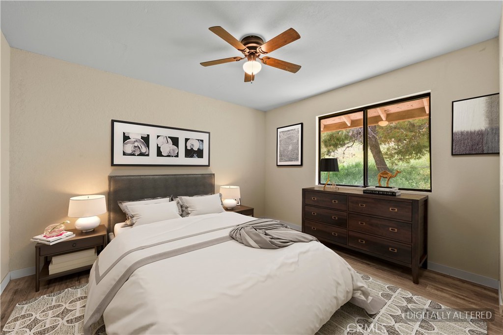 29570 Butterfield Way Tehachapi, CA 93561 - Photo 32 of 50 a bedroom with a bed and window