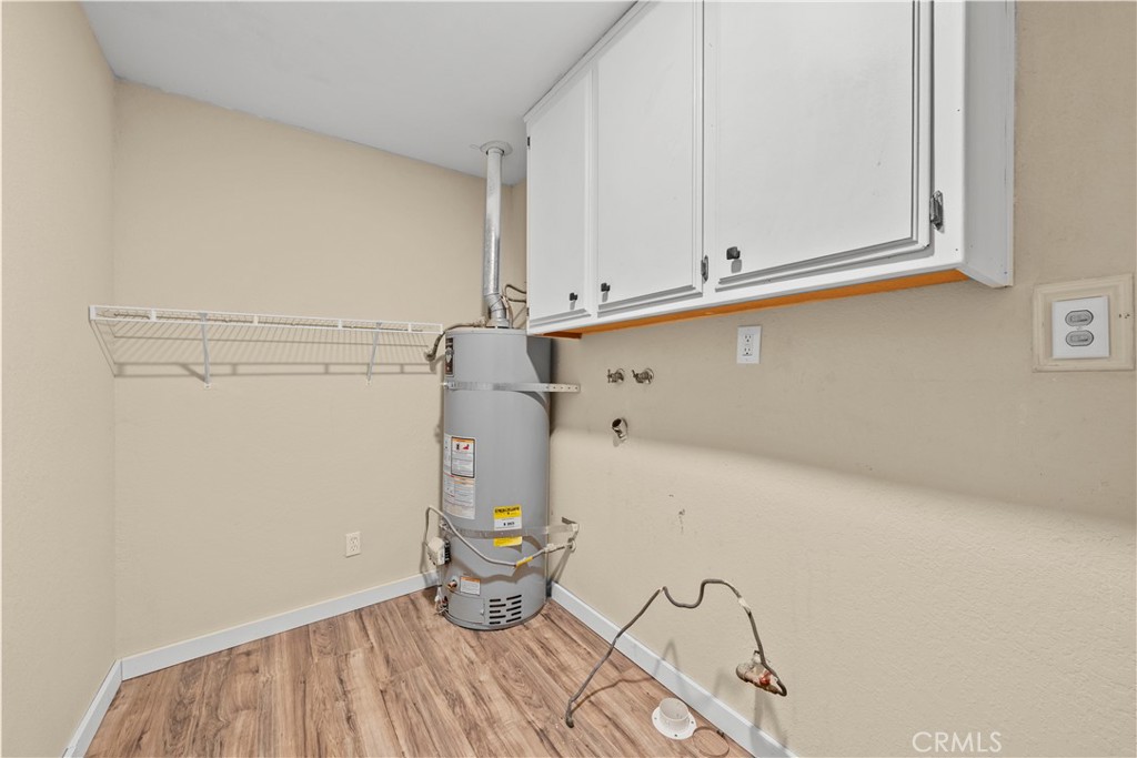 29570 Butterfield Way Tehachapi, CA 93561 - Photo 35 of 50 a view of storage and utility room with racks on the wall