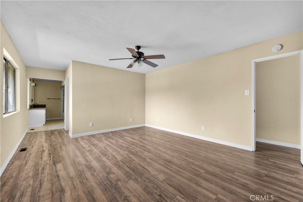 29570 Butterfield Way Tehachapi, CA 93561 - Photo 37 of 50 a view of empty room with wooden floor