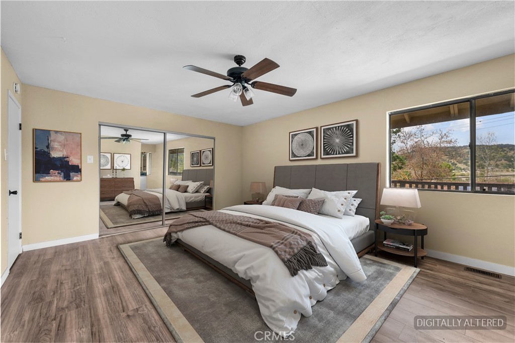 29570 Butterfield Way Tehachapi, CA 93561 - Photo 38 of 50 a bedroom with a large bed and a window