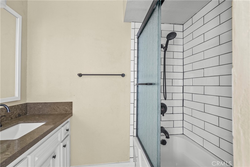 29570 Butterfield Way Tehachapi, CA 93561 - Photo 43 of 50 a bathroom with a granite countertop shower and sink