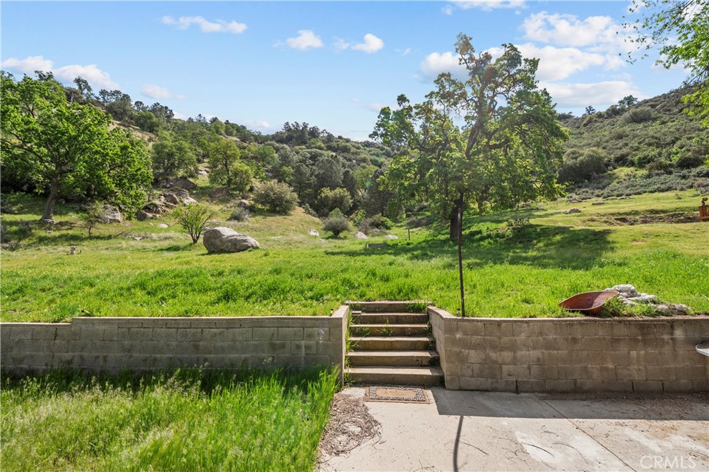 29570 Butterfield Way Tehachapi, CA 93561 - Photo 44 of 50 a view of a street with a garden