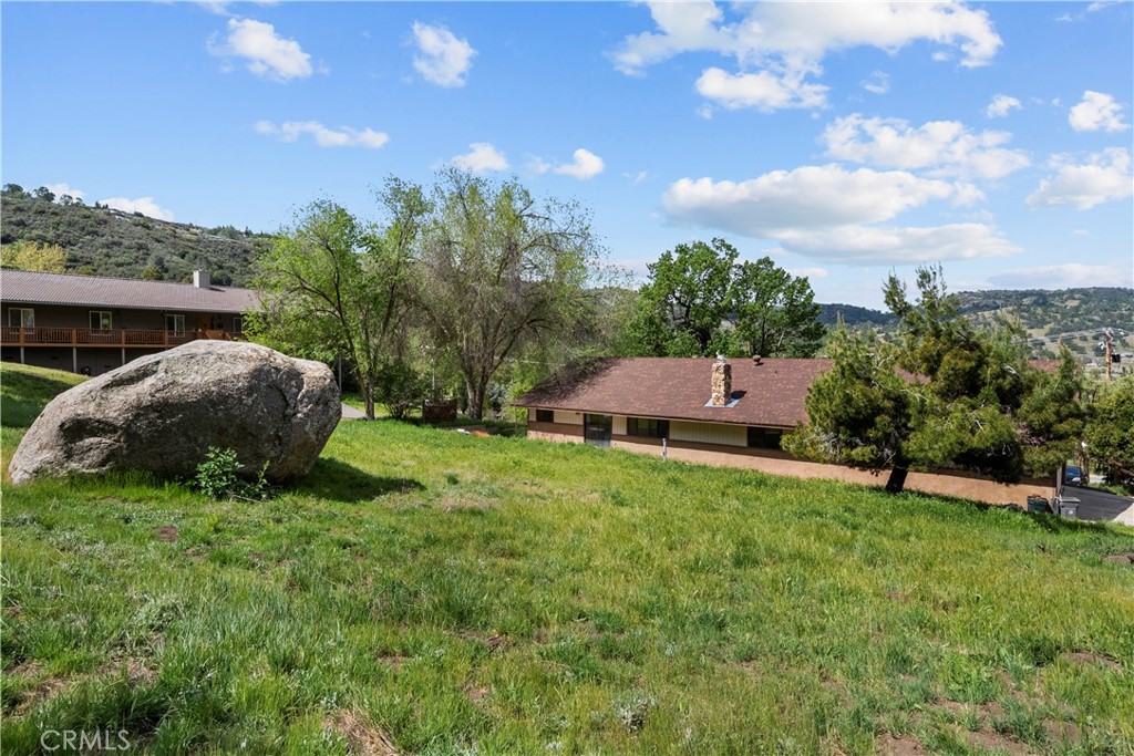 29570 Butterfield Way Tehachapi, CA 93561 - Photo 45 of 50 a view of an house with backyard space and garden