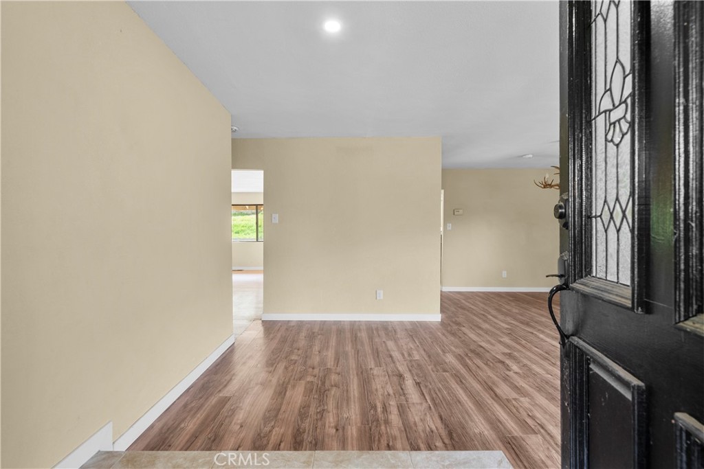 29570 Butterfield Way Tehachapi, CA 93561 - Photo 10 of 50 a view of a room with wooden floor and a window