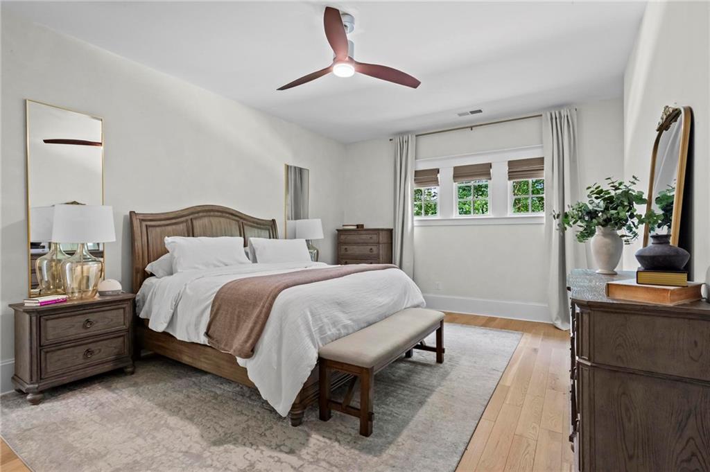 2630 Old Atlanta Road Cumming, GA 30041 - Photo 32 of 87 a bedroom with a bed and a potted plant