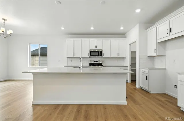 an empty room with closet area