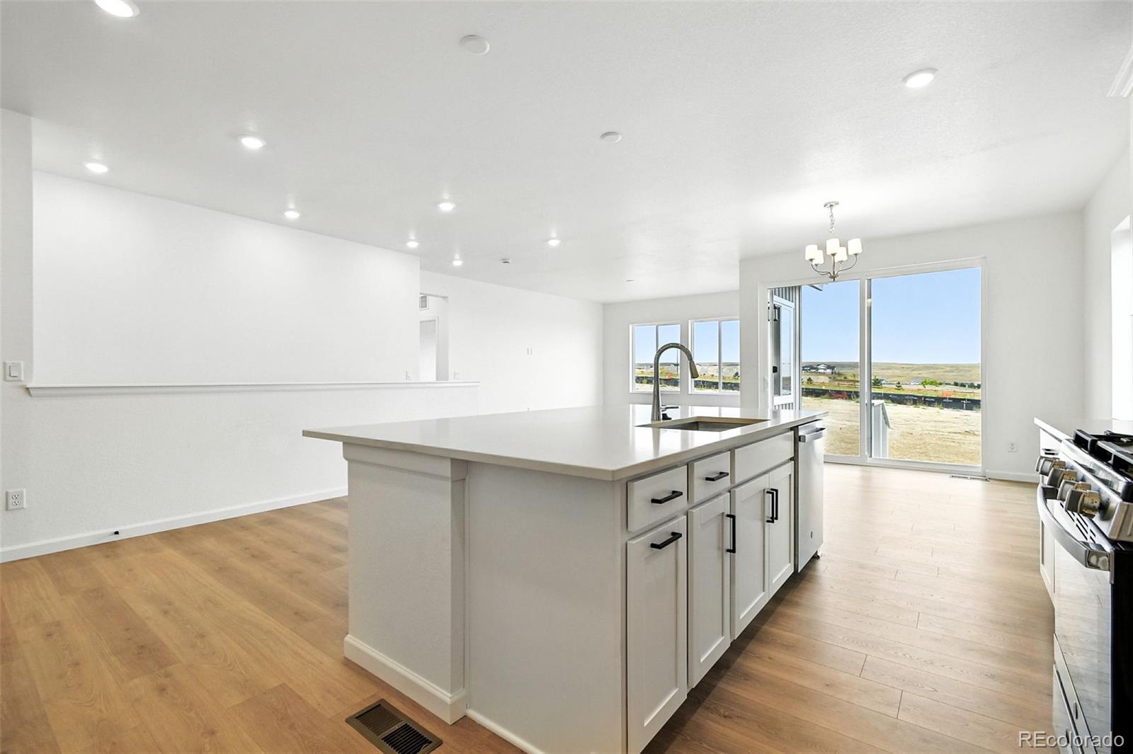 17075 West 92nd Loop Arvada, CO 80007 - Photo 16 of 33 a kitchen with stainless steel appliances granite countertop a sink and cabinets