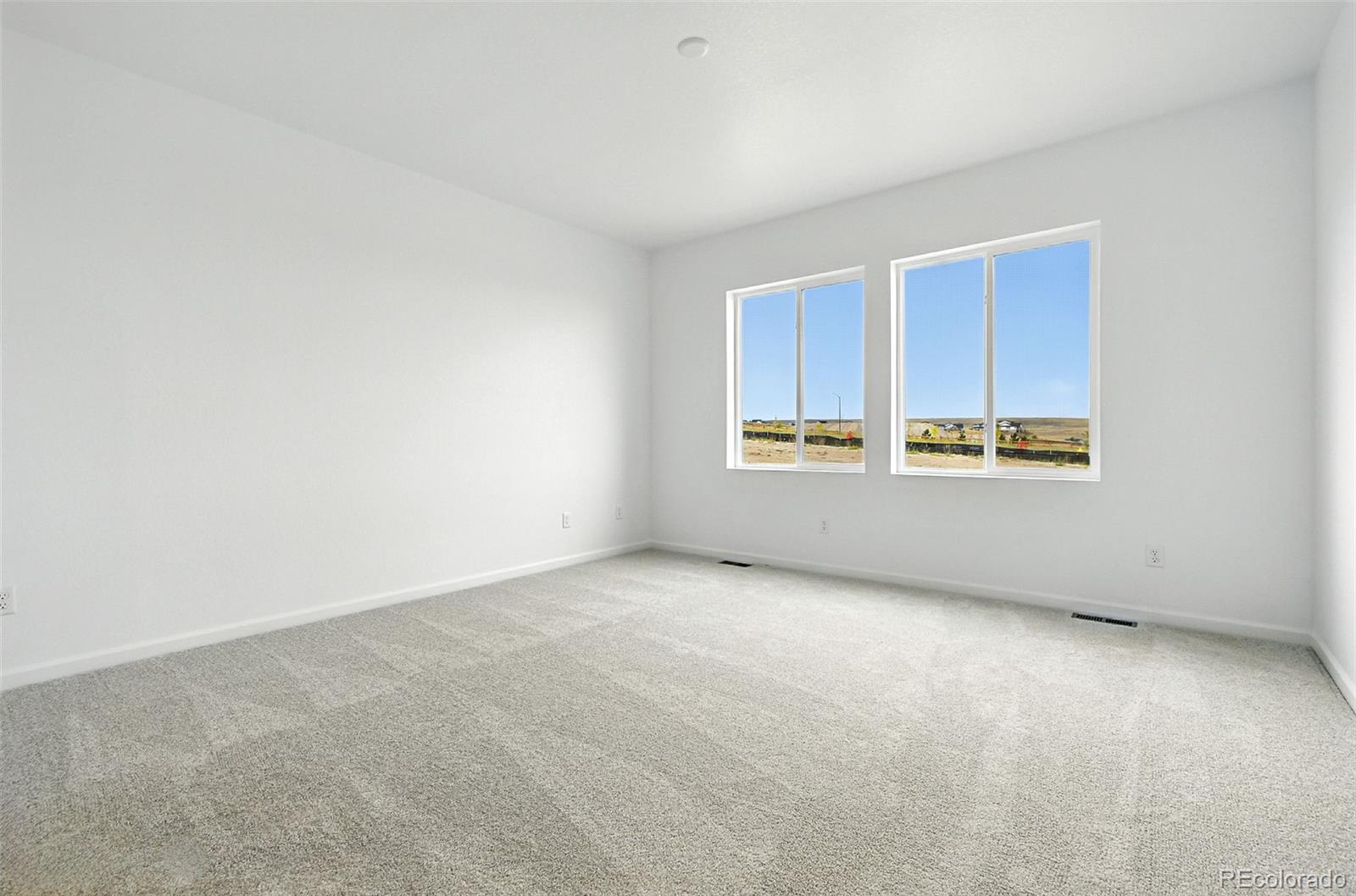 17075 West 92nd Loop Arvada, CO 80007 - Photo 17 of 33 an empty room with windows