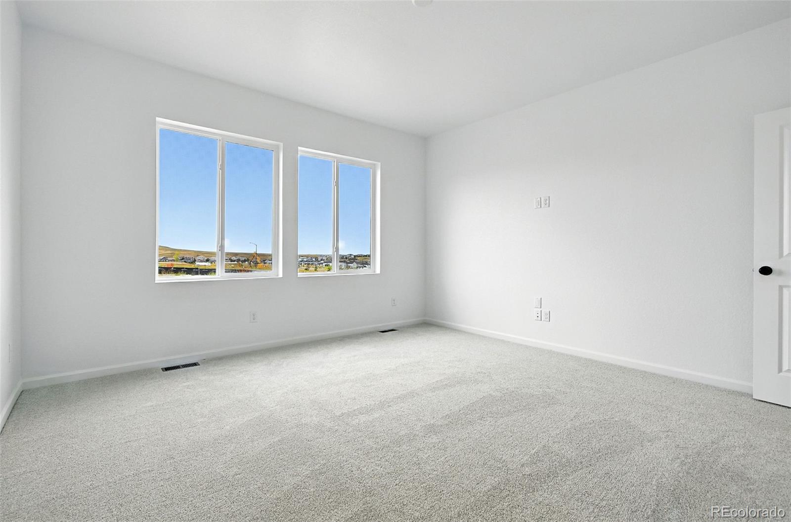 17075 West 92nd Loop Arvada, CO 80007 - Photo 19 of 33 a view of an empty room with a window