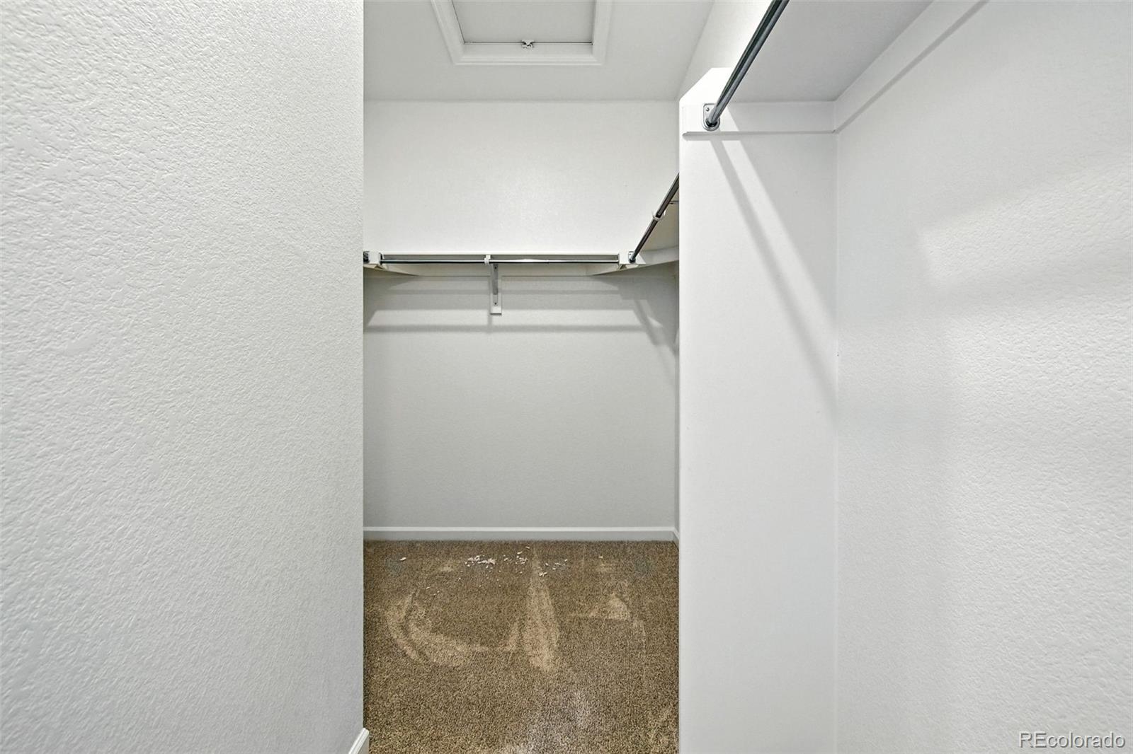 17075 West 92nd Loop Arvada, CO 80007 - Photo 21 of 33 a view of walk in closet with empty racks
