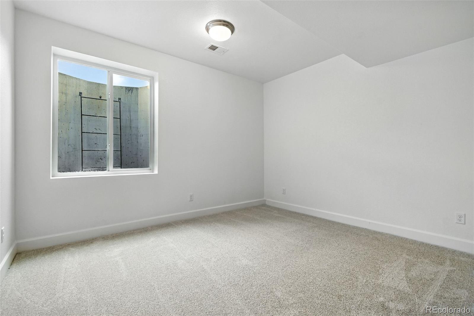 17075 West 92nd Loop Arvada, CO 80007 - Photo 26 of 33 an empty room with a window