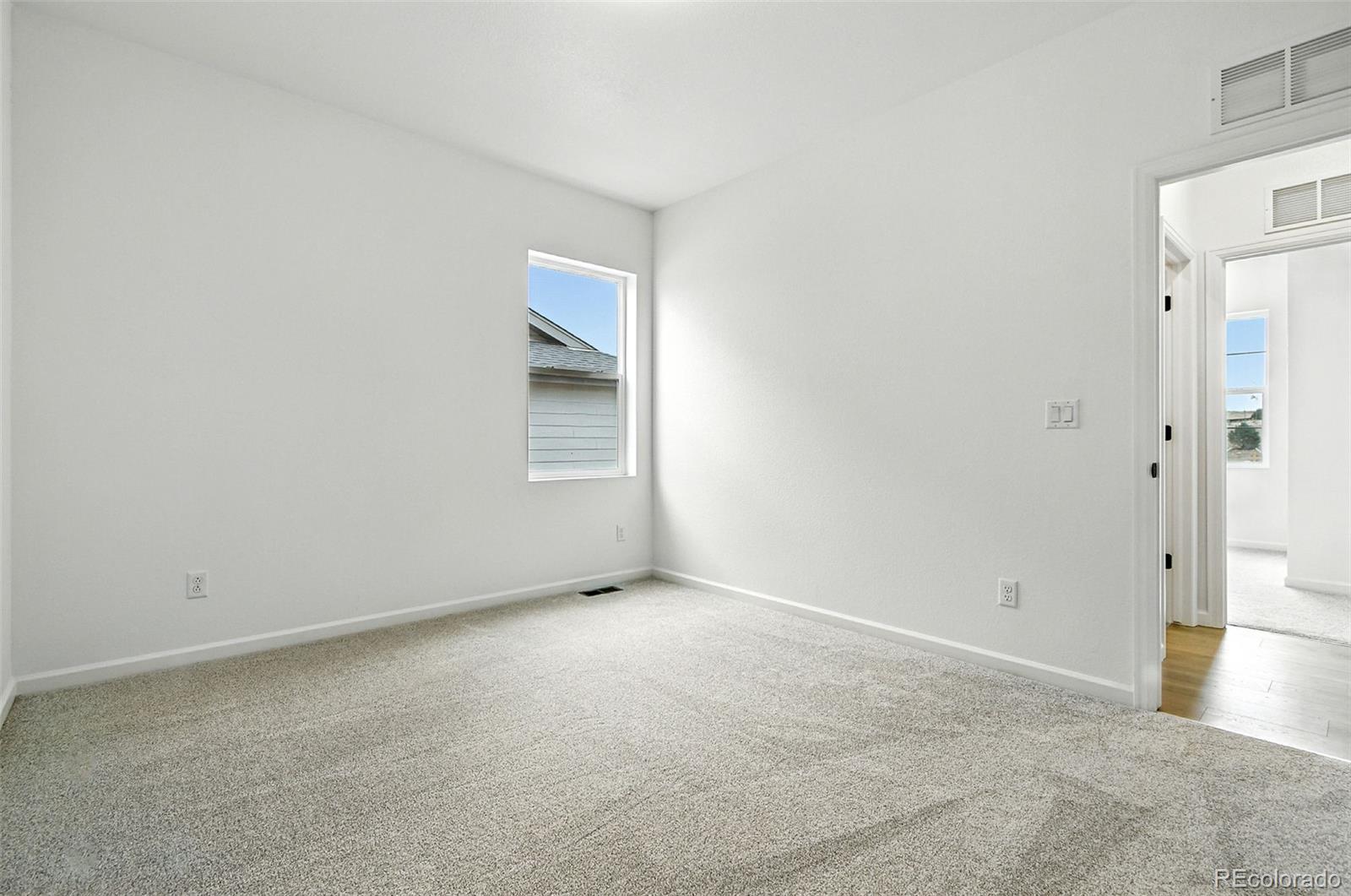17075 West 92nd Loop Arvada, CO 80007 - Photo 7 of 33 an empty room with windows
