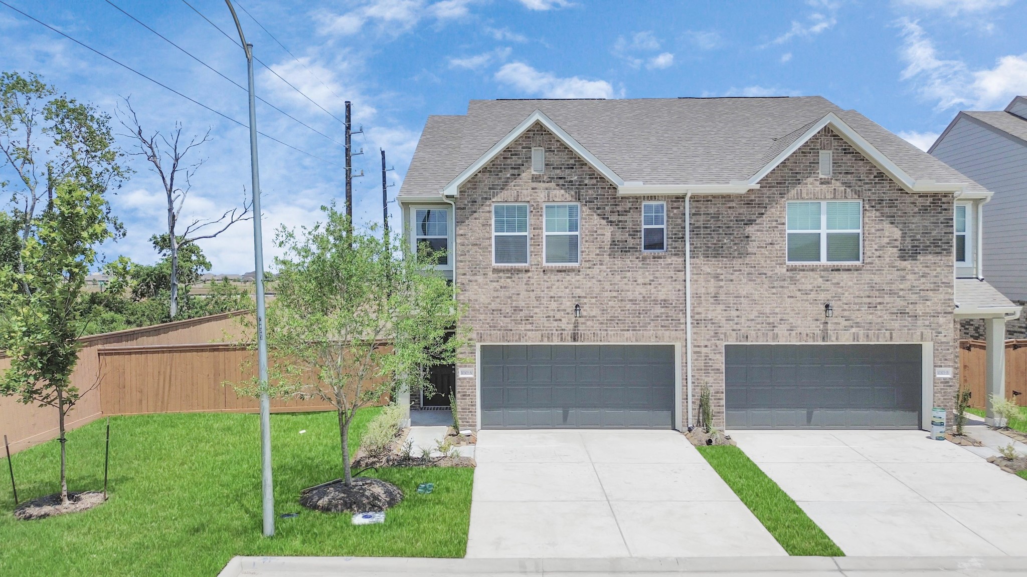 10303 Rose Mar Drive, Unit B Rosharon, TX 77583 - Photo 48 of 49 a front view of a house with a garden