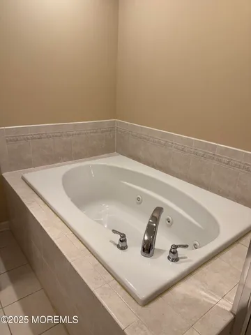 a bath tub sitting in a bathroom