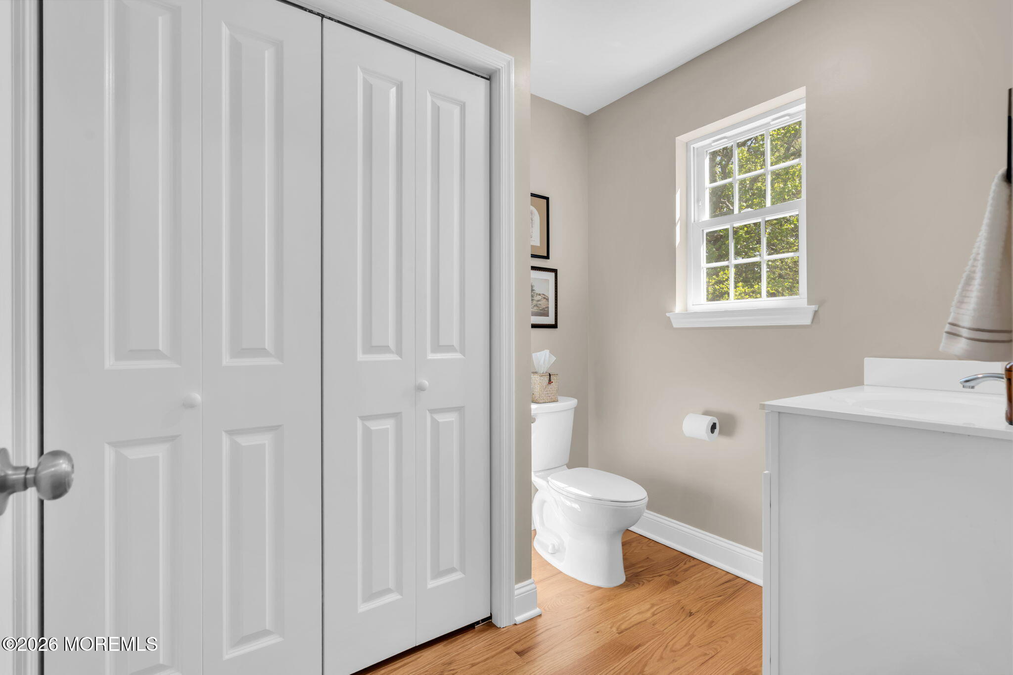 312 Beach Boulevard Forked River, NJ 08731 - Photo 25 of 40 a bathroom with a toilet a sink and a window