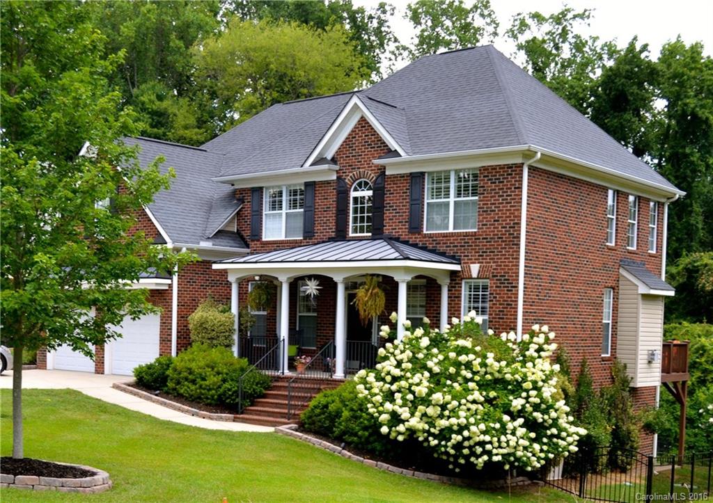 7119 Ramsgate Road, Unit 2C Charlotte, NC 28270 - Photo 2 of 3 a front view of a house with garden