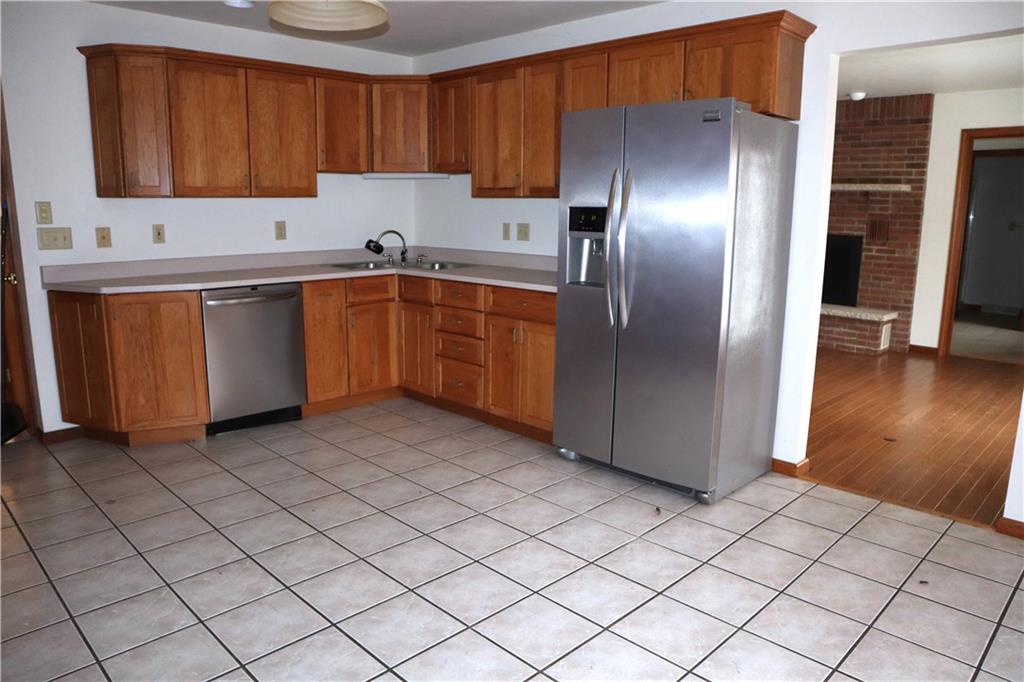 1600 Ramsey Run Road Indiana, PA 15701 - Photo 12 of 50 a kitchen with a sink a refrigerator and cabinets