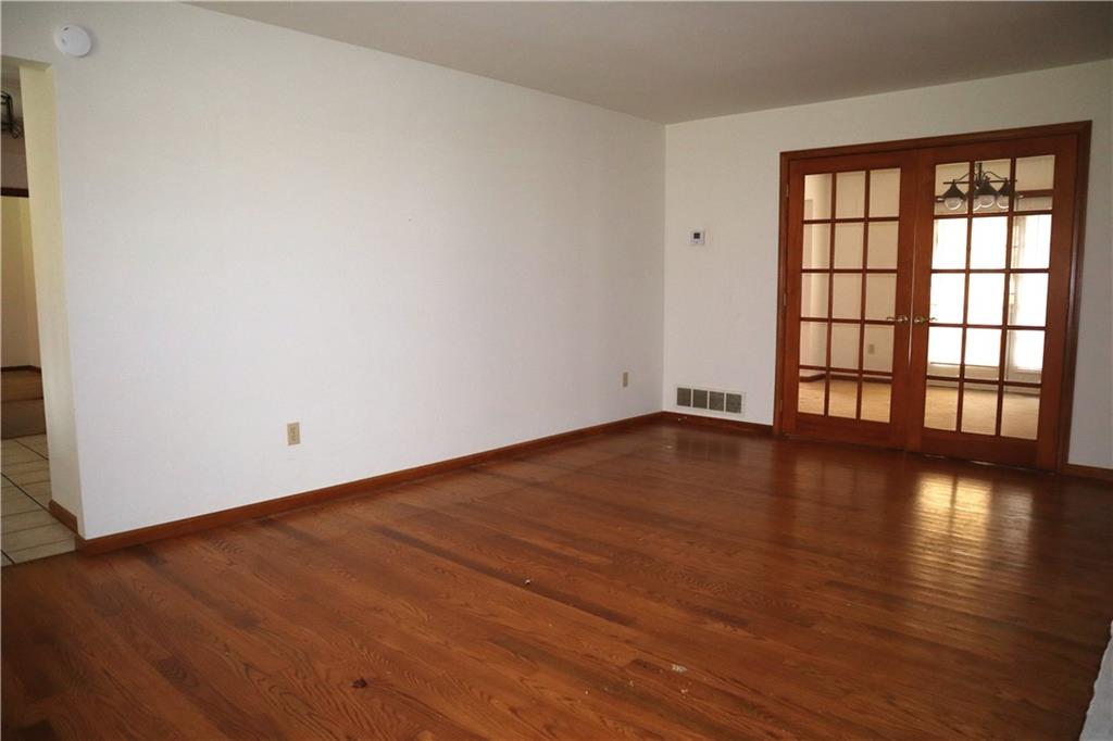 1600 Ramsey Run Road Indiana, PA 15701 - Photo 6 of 50 an empty room with wooden floor and windows