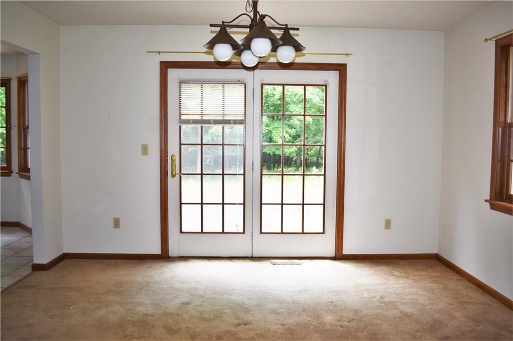 1600 Ramsey Run Road Indiana, PA 15701 - Photo 8 of 50 an empty room with windows and chandelier fan