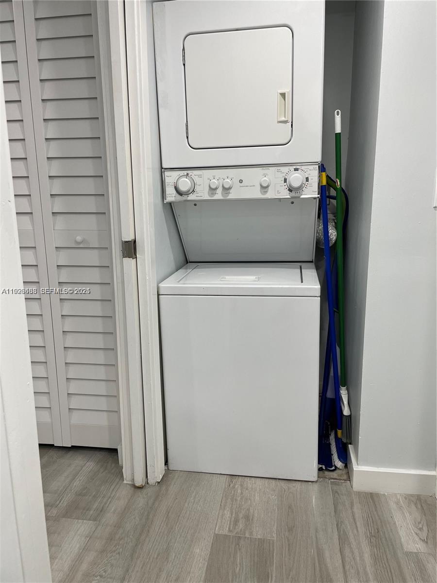 2031 Renaissance Boulevard, Unit 101 Miramar, FL 33025 - Photo 11 of 23 a utility room with dryer and washer