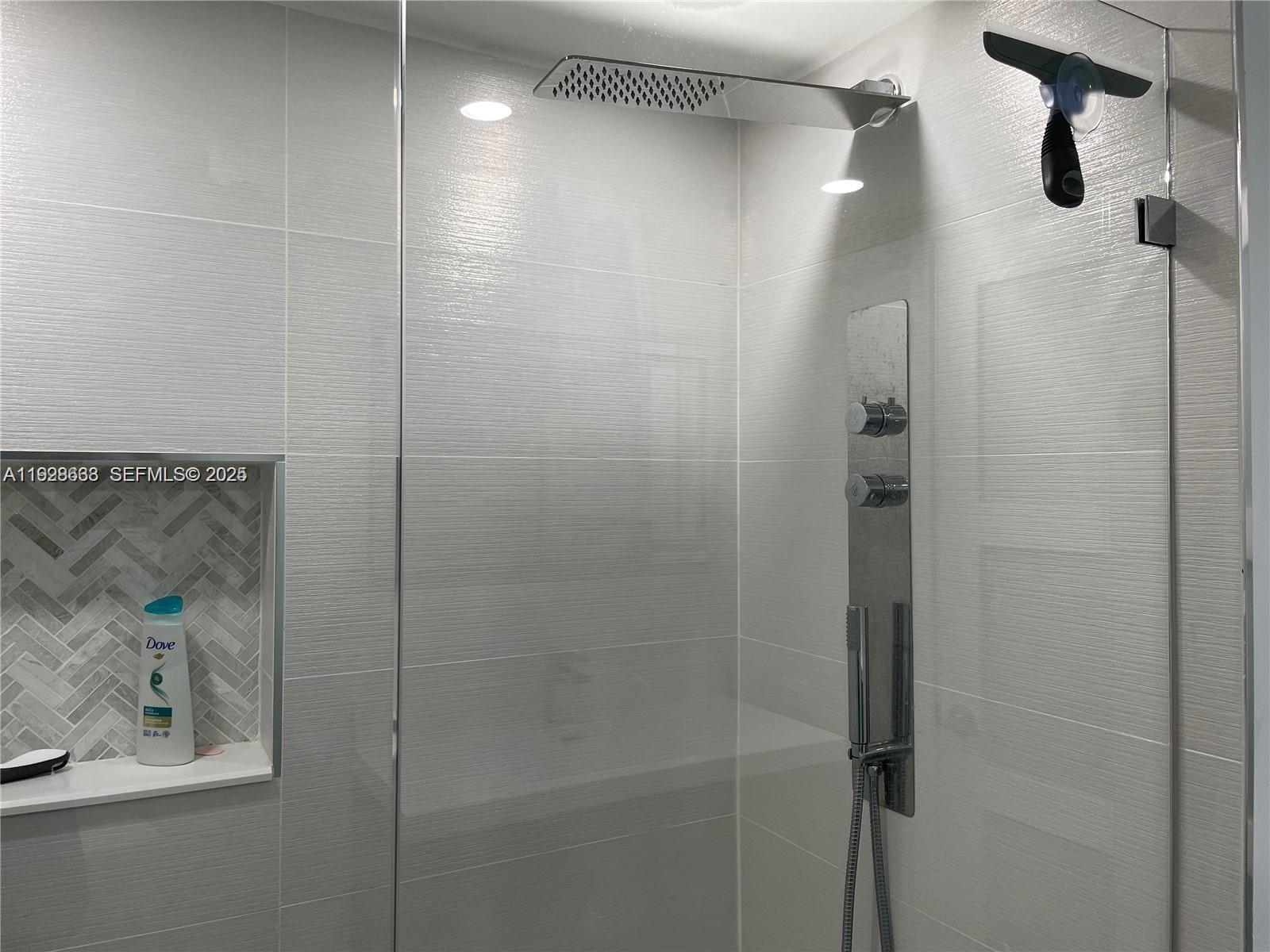 2031 Renaissance Boulevard, Unit 101 Miramar, FL 33025 - Photo 19 of 23 a bathroom with a shower