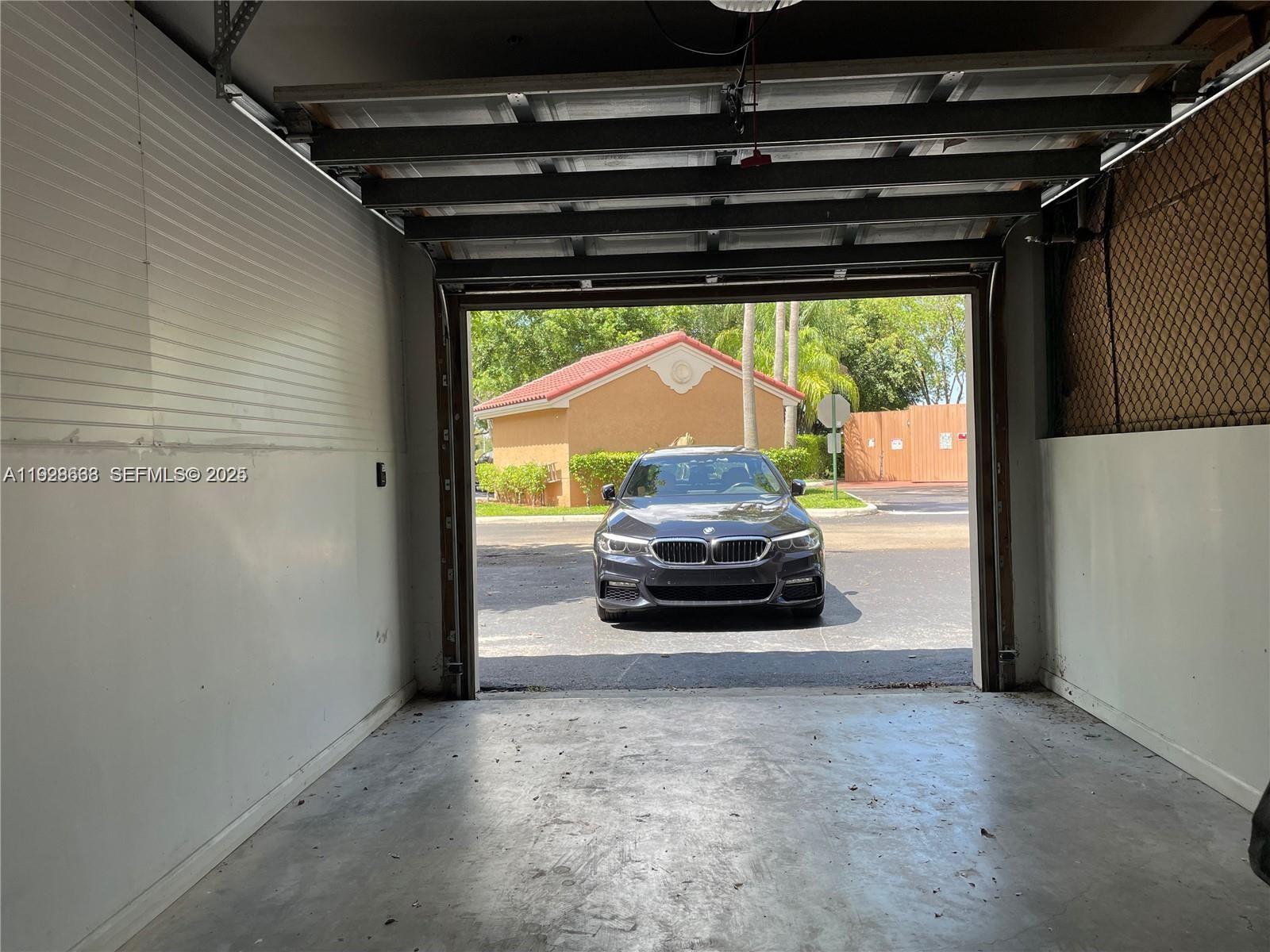 2031 Renaissance Boulevard, Unit 101 Miramar, FL 33025 - Photo 20 of 23 a car parked in front of a house