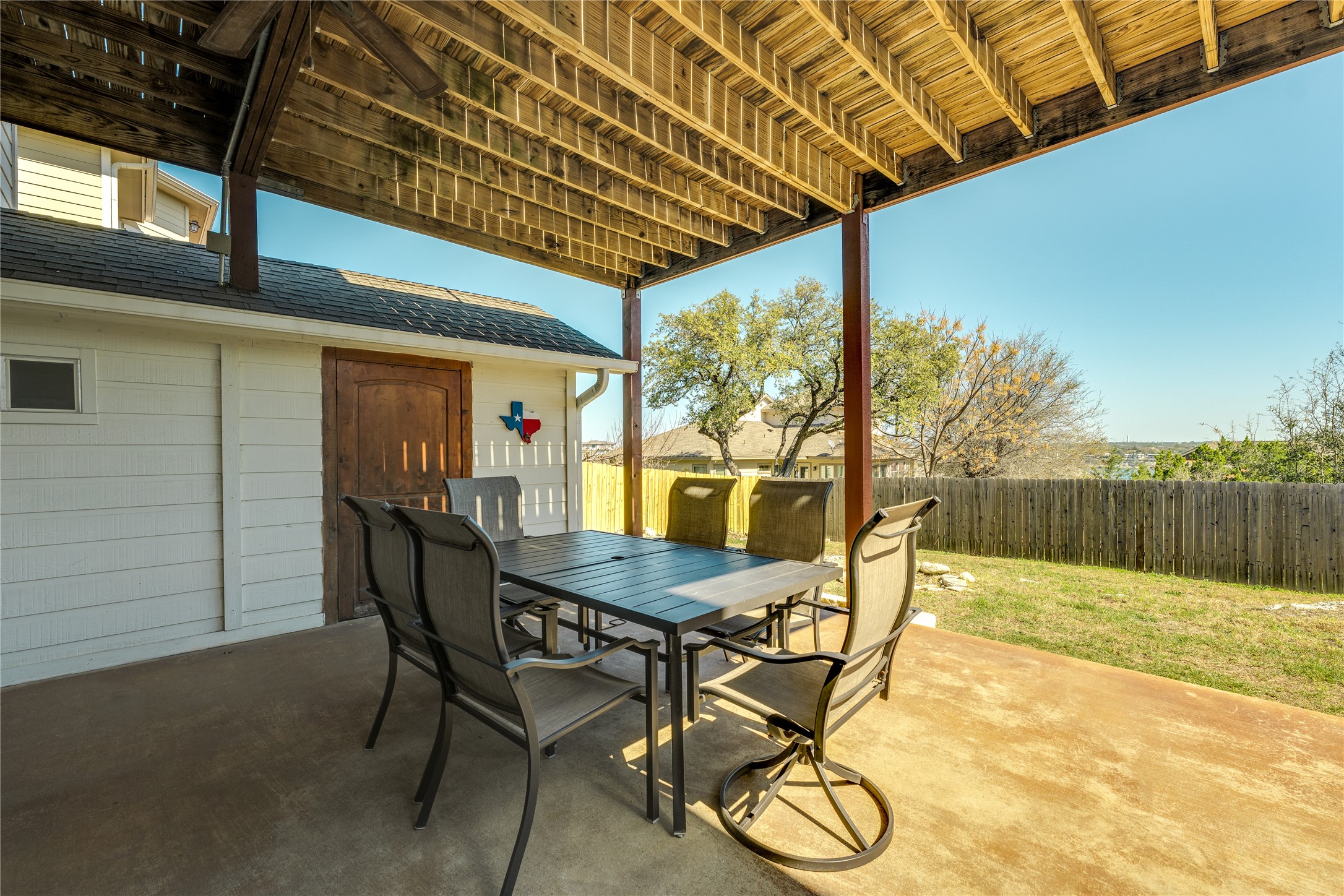 330 Southwind Road Point Venture, TX 78645 - Photo 25 of 39 Just off the patio us a climate controlled shed.
